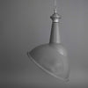 Large grey vitreous enamel factory pendant lights with angled shade for directional task lighting.