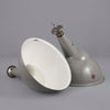 Large grey vitreous enamel factory pendant lights with angled shade for directional task lighting.