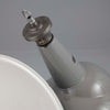Large grey vitreous enamel factory pendant lights with angled shade for directional task lighting.