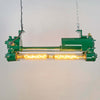a vintage industrial tube light reclaimed from old ships and fully restored by the team at Loomlight in UK. It is a twin tube light fitted with Edison filament LED tubes that are dimmable. The aluminium body is painted a deep green. This is a unique showstopper of a ceiling light.