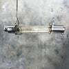 Shop for a vintage strip light in aluminium with a flameproof glass tube enclosure. Fitted with dimmable LED filament tubes. Vintage industrial ceiling lighting restored & reclaimed ready to for modern interiors