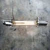 Shop for a vintage strip light in aluminium with a flameproof glass tube enclosure. Fitted with dimmable LED filament tubes. Vintage industrial ceiling lighting restored & reclaimed ready to for modern interiors