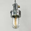 A vintage industrial pendant light made from cast aluminium and toughened glass fitted with a LED filament tube. Originally an industrial light made by Baliga restored and sold by Loomlight for modern use