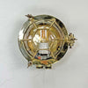 A brass industrial round bulkhead light with a protective hexagonal cage. Sometimes described as a bullseye lamp due to the design of the cage this original vintage brass wall light is reclaimed from marine environments and professionally refurbished and rewired by hand in our workshop ready for indoor use