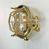 Solid brass bulkhead light with a protective hexagonal cage. These original vintage industrial wall lights are reclaimed from marine settings and professionally refurbished and rewired by hand in our workshop ready for indoor use.