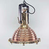 This is a large vintage industrial copper and brass industrial cargo ceiling light made by the German manufacturer Wiska. It consists of a fluted spun copper dome with cast brass top section . It has wing nuts on the hanging mount so that the light can be tilted and illumination directional.