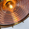 This is a large vintage industrial copper and brass industrial cargo ceiling light made by the German manufacturer Wiska. It consists of a fluted spun copper dome with cast brass top section . It has wing nuts on the hanging mount so that the light can be tilted and illumination directional.