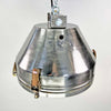 industrial ceiling light in aluminium with a cage covering the glass lens. Reclaimed and restored for modern interiors, This was originally manufactured by VEB Leuchtenbau Wittenberg and restored by Loomlight Design in UK