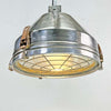 industrial ceiling light in aluminium with a cage covering the glass lens. Reclaimed and restored for modern interiors, This was originally manufactured by VEB Leuchtenbau Wittenberg and restored by Loomlight Design in UK