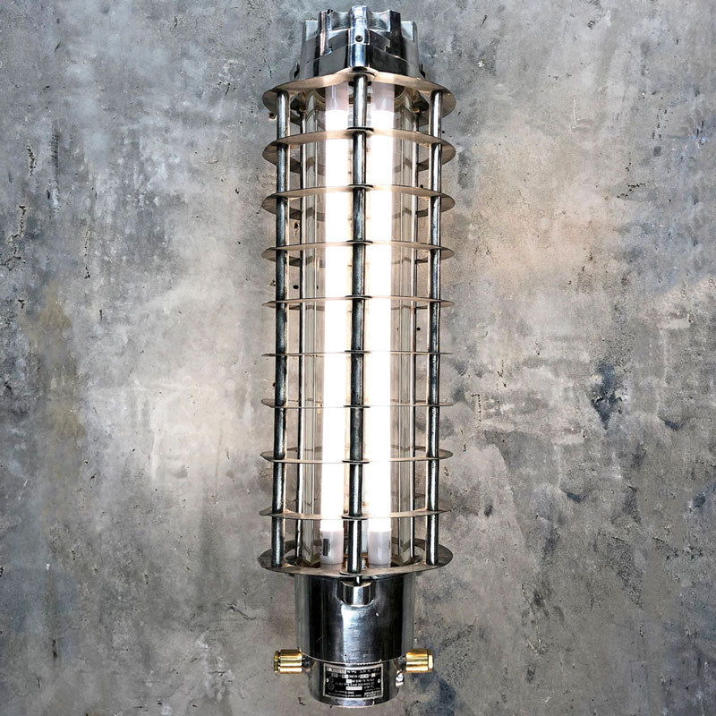 Vintage industrial strip light for wall mounting. With cage and LED tubes which are dimmable. Manufactured by Aqua Signal a German manufacturer of industrial fixtures & fittings. .