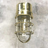 Shop our vintage brass ships light. A 90 degree lamp with cast brass cage and tempered glass cover.Industrial lighting reclaimed and restored for modern interiors. This wall lamp can be used outdoors. It is compatible with an LED light bulb. Manufactured by Daeyang a Korean company who made fixtures for industrial purposes.