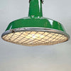 A green enamel rustic ceiling light with bronze top section and metal cage made in England by Thorlux circa 1940.