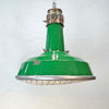 A green enamel rustic ceiling light with bronze top section and metal cage made in England by Thorlux circa 1940.