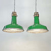 A green enamel rustic ceiling light with bronze top section and metal cage made in England by Thorlux circa 1940.