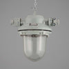 Industrial pendant light with a gray finish on a gray background