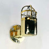 Shop for a small brass nautical wall light. Reclaimed from old ships and restored. This small vintage wall light features a brass cage and tempered glass which covers and protects the lamp holder. Can be used both as small indoor lighting or small outdoor lighting