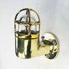 Shop for a small brass nautical wall light. Reclaimed from old ships and restored. This small vintage wall light features a brass cage and tempered glass which covers and protects the lamp holder. Can be used both as small indoor lighting or small outdoor lighting