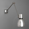 A Czechoslovakian wall-mounted vintage industrial cantilever wall lamp with adjustable arm on a gray background made by Elektrosvit