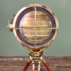 Shop the brass daylight signal lamp. A morse code light reclaimed from Navy ships. Paired with a Stanley of London tripod to create a bespoke signal light tripod floor lamp.