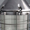 Close-up of a metal industrial-style light fixture with a cage.