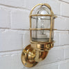 Reclaimed retro industrial style brass cage lighting for the wall