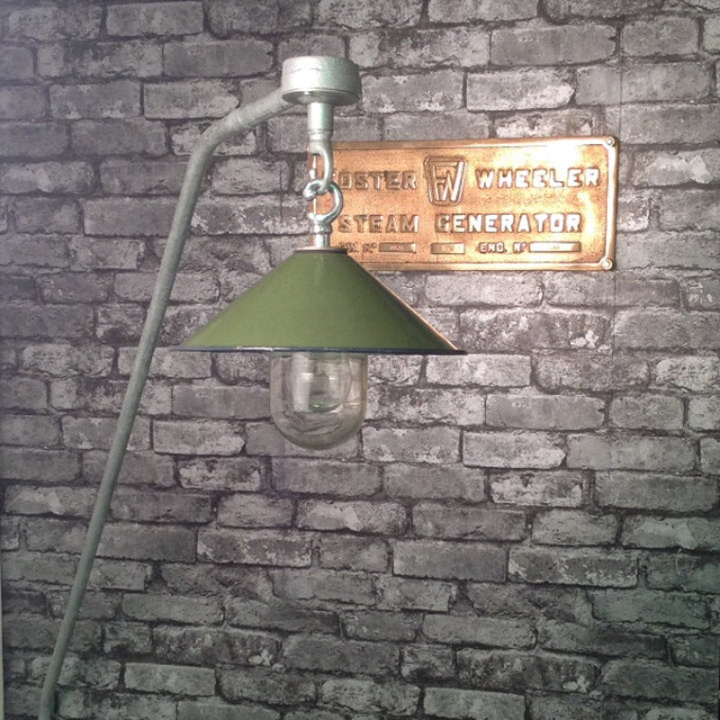 A reclaimed green enamel wall pendant with cantilever.