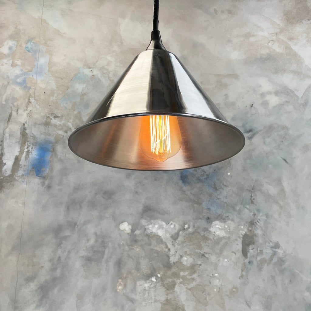 small aluminium conical ceiling pendant light with Edison filament LED light bulb. It is  an industrial style ceiling light, the design is based on vintage British military festoon shades