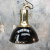 A brass and black enamel industrial ceiling pendant.