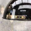 A brass and black enamel reclaimed industrial ceiling pendant.