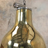 A vintage brass dome ceiling pendant light fixture with an aluminium industrial style cage.