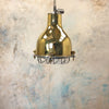 A vintage brass dome ceiling pendant light fixture with an aluminium industrial style cage.