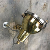 A reclaimed retro industrial cast brass directional outdoor wall washer light.