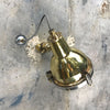 A reclaimed retro industrial cast brass directional outdoor wall washer light.