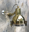 A reclaimed retro industrial cast brass directional outdoor wall washer light.