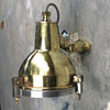 A reclaimed retro industrial cast brass directional outdoor wall washer light.