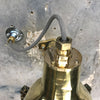 A reclaimed retro industrial cast brass directional outdoor wall washer light.