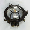 Shop our black round bulkhead made from black cast iron with a glass dome cover which has a cage protector. This vintage industrial wall light is an ideal feature light for ultimate industrial chic