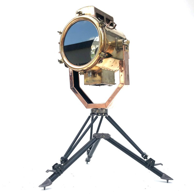 A reclaimed industrial 1980's copper and brass searchlight coupled with military tripod bespoke floor lamp