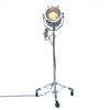 Retro industrial aluminium explosion proof cargo light with a telescopic Matthews theatre stand to create a large bespoke floor standing lamp.