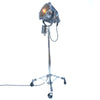 Retro industrial aluminium explosion proof cargo light with a telescopic Matthews theatre stand to create a large bespoke floor standing lamp.