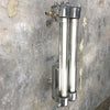 A vintage industrial twin T8 flameproof wall strip light, restored for modern interiors. An industrial style wall light with an aluminium body & flameproof glass tubes.