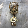 A vintage industrial Wiska industrial brass wall light with a protective brass wire cage & junction box.