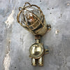 A vintage industrial Wiska industrial brass wall light with a protective brass wire cage & junction box.