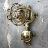 A vintage industrial Wiska industrial brass wall light with a protective brass wire cage & junction box.