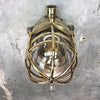 A vintage industrial Wiska industrial brass wall light with a protective brass wire cage & junction box.