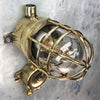 A vintage industrial Wiska industrial brass wall light with a protective brass wire cage & junction box.