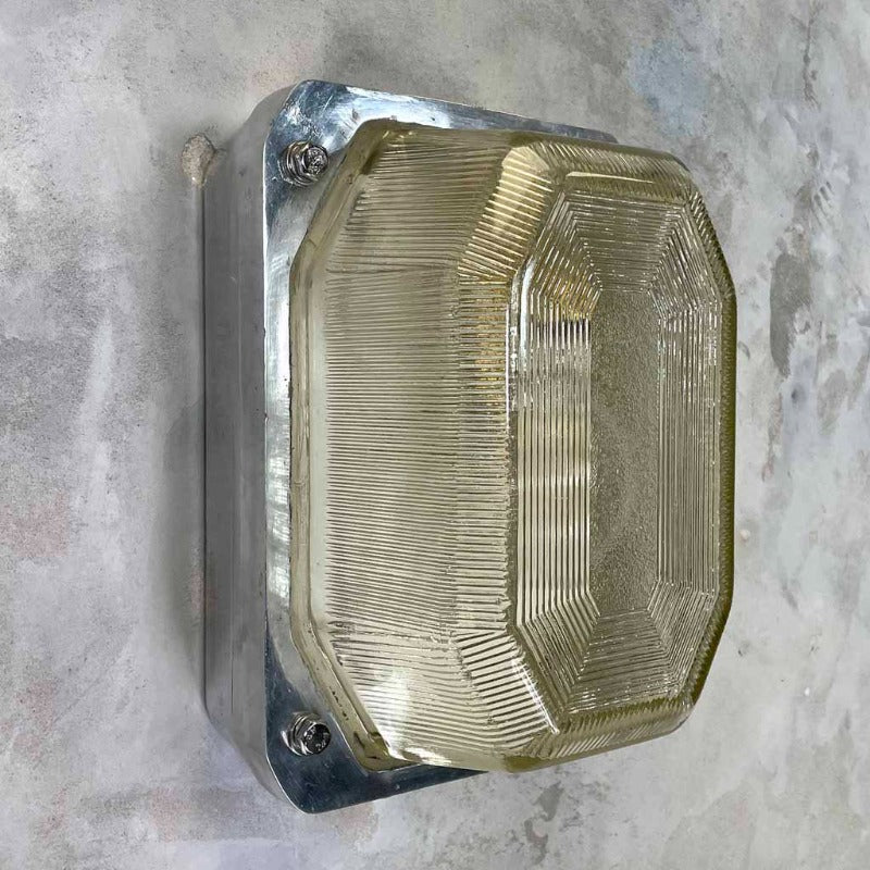 Vintage British made cast aluminium bulkhead wall lighting by Victor with a prismatic glass cover
