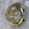 Shop our industrial brass bulkhead light reclaimed from the marine industry. The vintage wall light is professionally restored and compatible with LED light bulbs. We ship worldwide.
