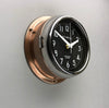 A non-ticking copper circular wall clock with black face, reclaimed and restored by AC.GMT.Co.