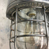 A late centuryindustrial cast aluminum ceiling light with explosion proof glass dome and cage by Kukdong Elecom